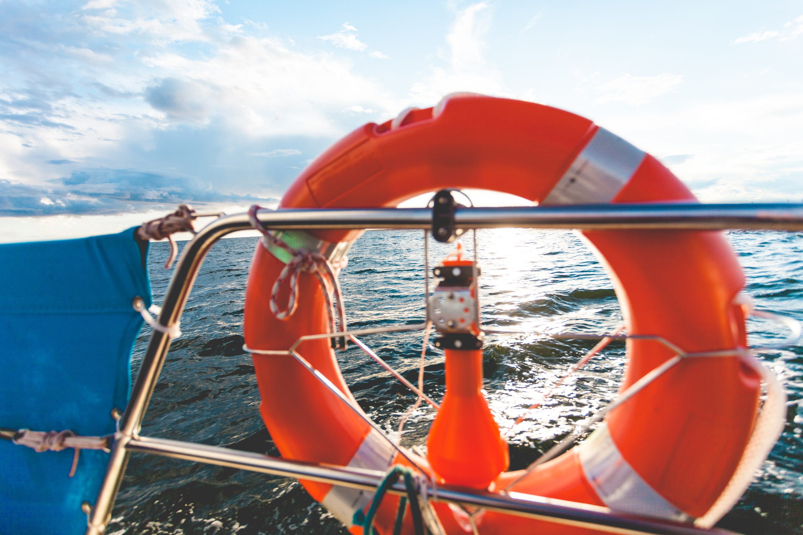 Boat on open water at sunrise