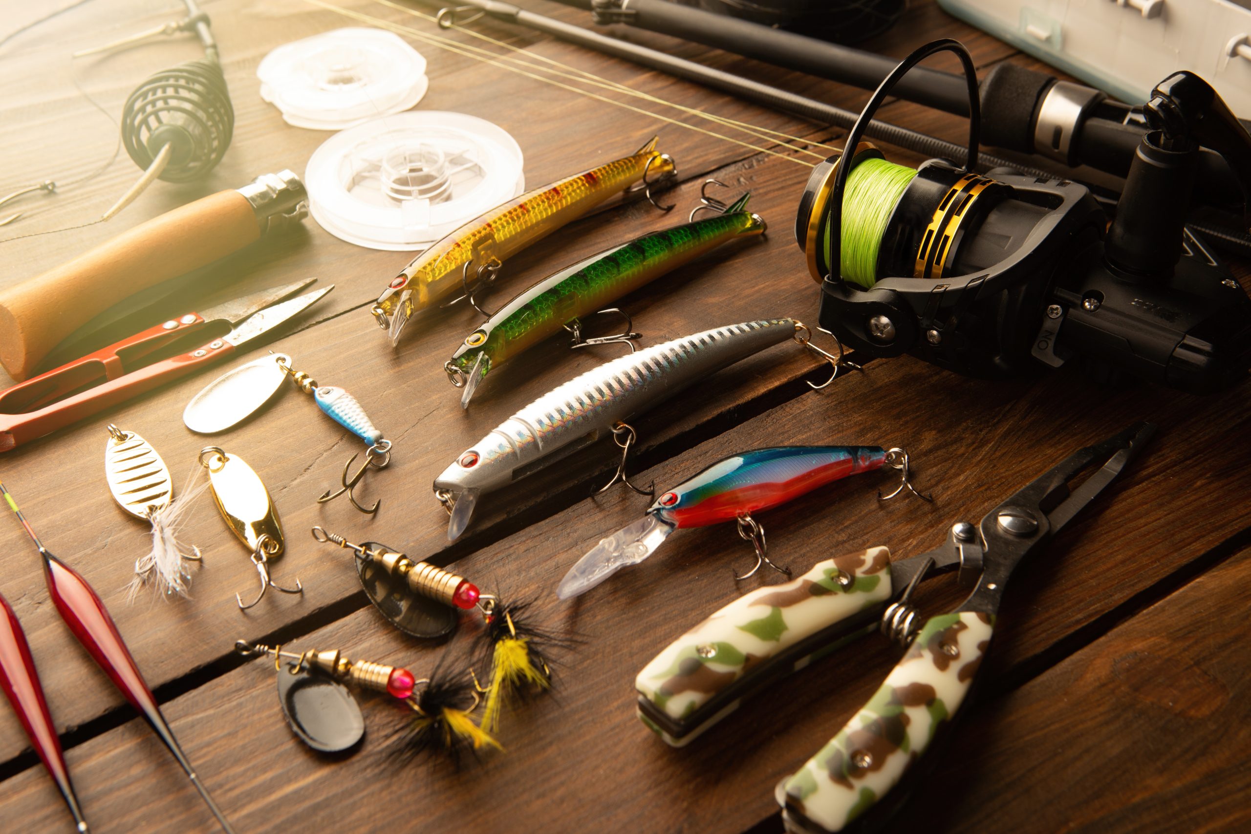 Fishing tackle laid out on a wooden dock